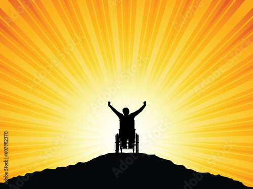 Silhouette of a man in a wheelchair with his arms raised in success