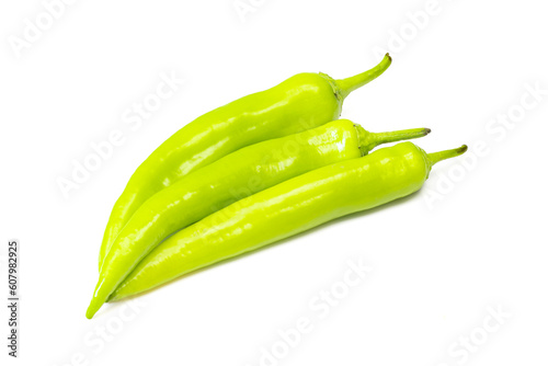 Stack of fresh green spicy paprikas isolated on white background. Fresh shiny vegetables