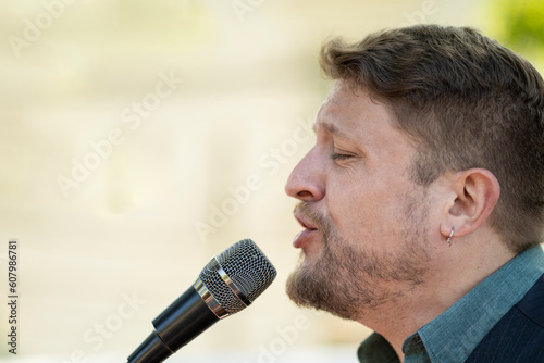 Close-up of musician singing in the street