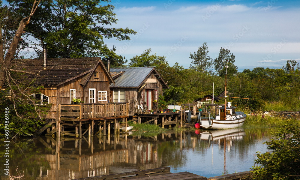 Finn Slough Panorama. Motorbot at Fishermen Village.  The historic fishing settlement of Finn Slough on the banks of the Fraser River in Richmond, British Columbia, Canada