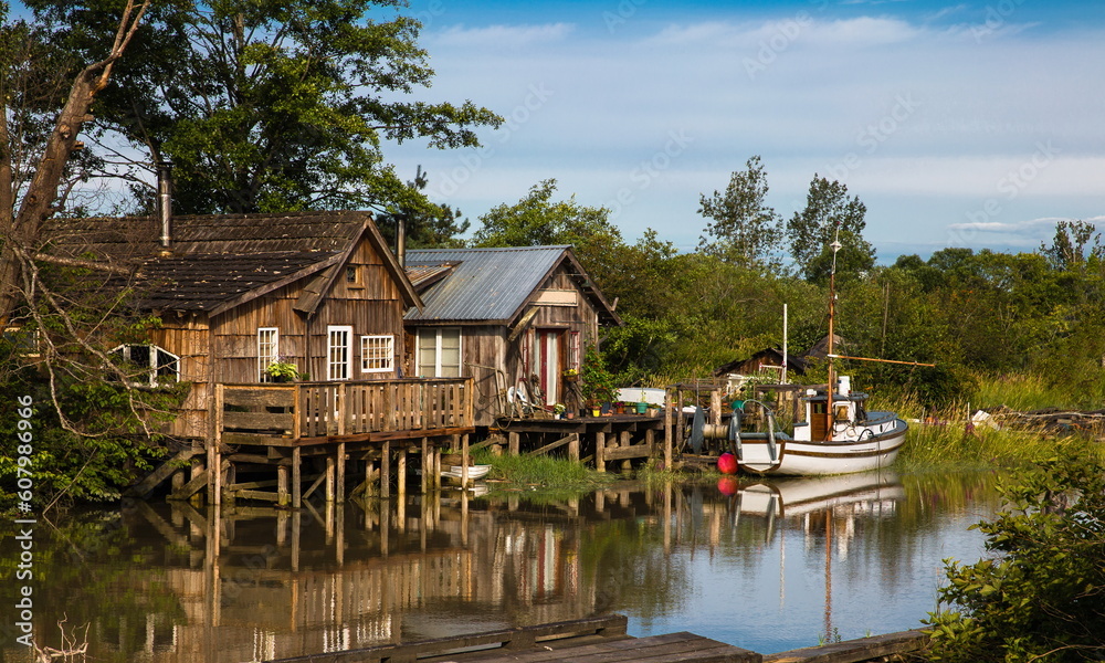 Finn Slough Panorama. Motorbot at Fishermen Village. The historic fishing settlement of Finn Slough on the banks of the Fraser River in Richmond, British Columbia, Canada Finn Slough Panorama. Motorbot at Fishermen Village. The historic fishing settlement of Finn Slough on the banks of the Fraser River in Richmond, British Columbia, Canada