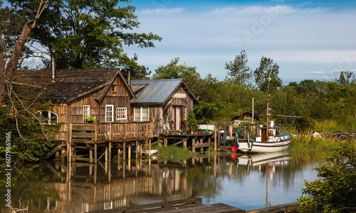 Finn Slough Panorama. Motorbot at Fishermen Village. The historic fishing settlement of Finn Slough on the banks of the Fraser River in Richmond, British Columbia, Canada