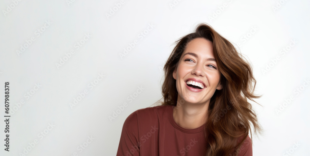 Portrait of a beautiful young woman laughing on a white background. Portrait of a beautiful young woman laughing on a white background.