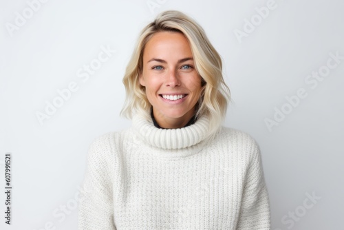 Medium shot portrait photography of a pleased woman in her 30s that is wearing a cozy sweater against a white background . Generative AI