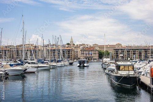 Old Port (Vieux-Port de Marseille) with several boats moored in the marina of Marseille. MARSEILLE, FRANCE. May 29, 2023. © dbrnjhrj
