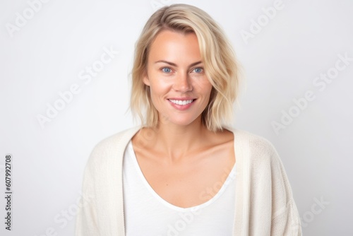 Portrait of a beautiful young blond woman on a white background.