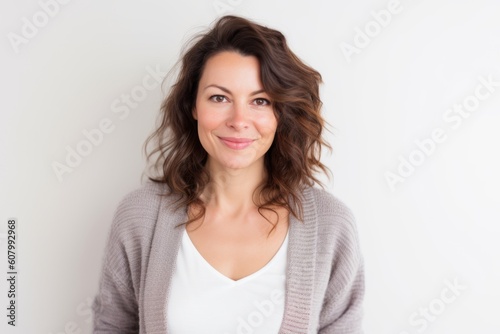 Portrait of a beautiful young woman smiling at the camera over white background