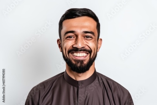 Portrait of a happy young man smiling isolated on a white background