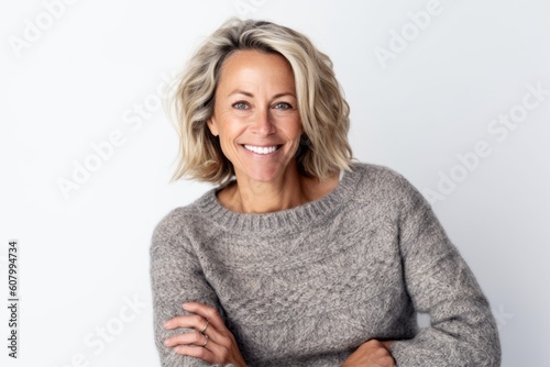 Group portrait photography of a pleased woman in her 40s that is wearing a cozy sweater against a white background . Generative AI