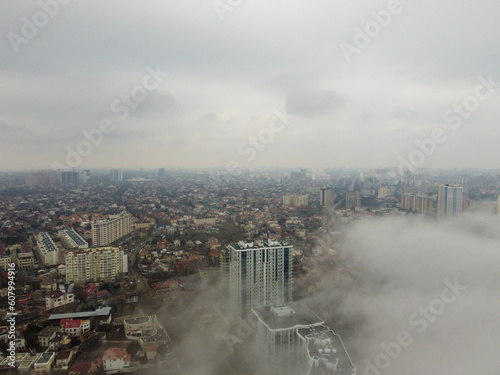 Foggy morning in the city buildings growing through the mist and fog  © rusevdmitrii