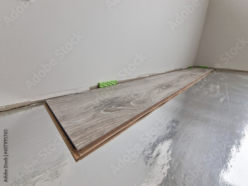Принти на полотні Laminate flooring installation process close up