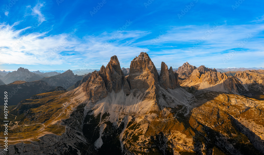 The rocky peaks of Tre Chime di Lavaredo sunset. The edges of the high peaks lighted by the rays of the sun