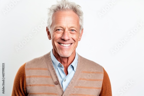 Portrait of a happy senior man smiling at camera against white background