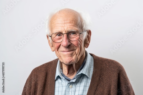 Portrait of a senior man with eyeglasses on white background