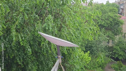 Starlink satellite dish, an internet constellation operated by SpaceX, is installed on the wall of an apartment building.
