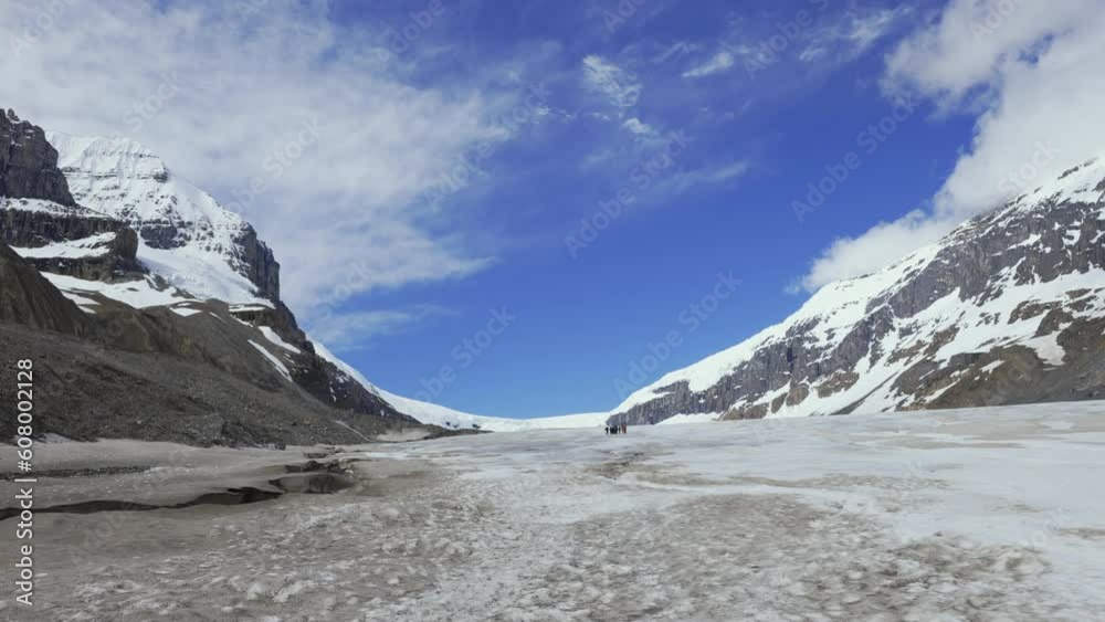 Walking on the vast ice fields of the Athabasca Glacier in Canada Walking on the vast ice fields of the Athabasca Glacier in Canada