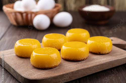 Quindim, traditional egg and coconut brazilian dessert with ingredients