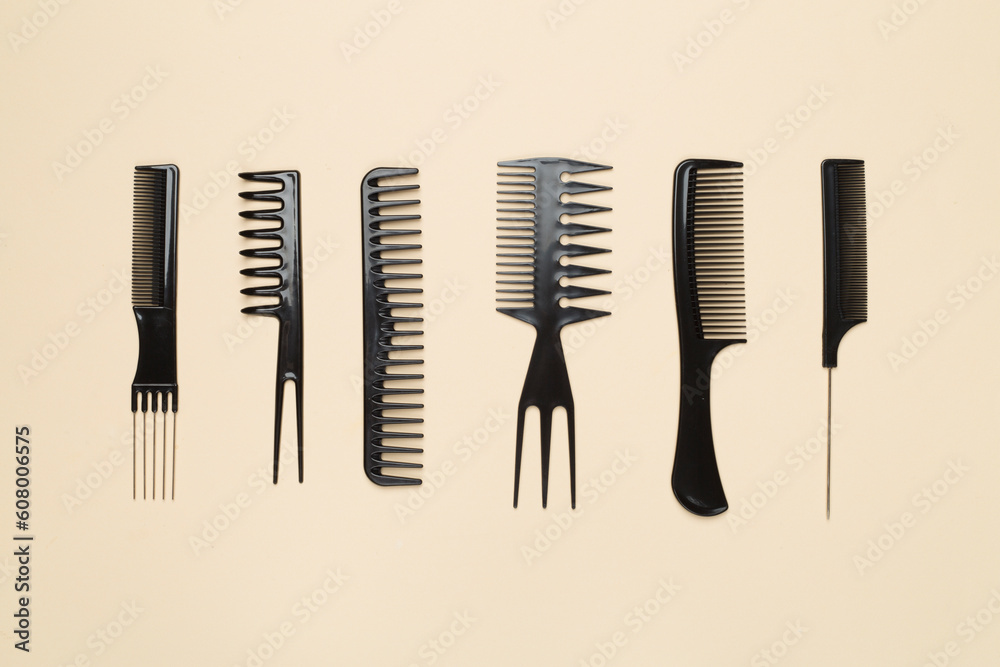 Professional combs and hairdresser tools on color background, top view Professional combs and hairdresser tools on color background, top view