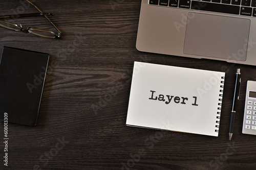 There is notebook with the word Layer 1. It is as an eye-catching image.