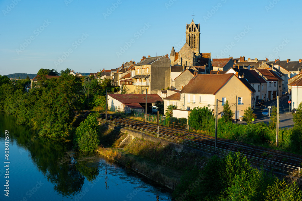 Scenic view of ancient church and houses of Dormans commune at summer day, France