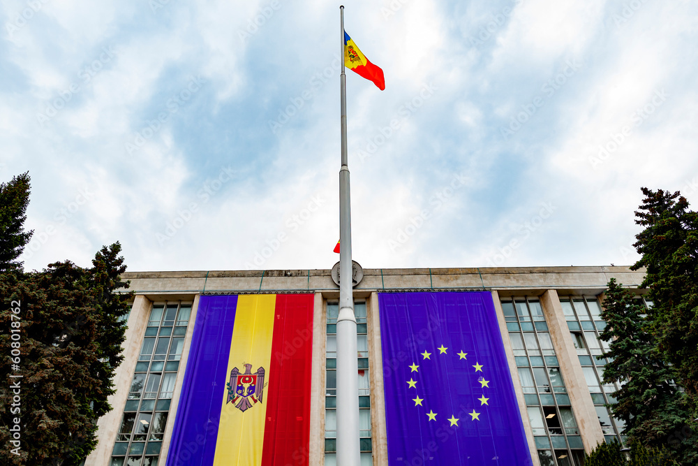 Large flags of Moldova and the European Union on the building of the Government of Moldova on the eve of the summit of the European Political Community