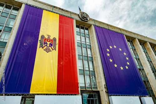 Large flags of Moldova and the European Union on the building of the Government of Moldova on the eve of the summit of the European Political Community photo