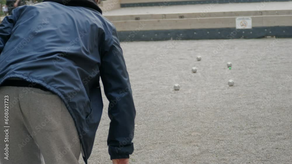 Petanque balls boules bowls on sand gravel court background in