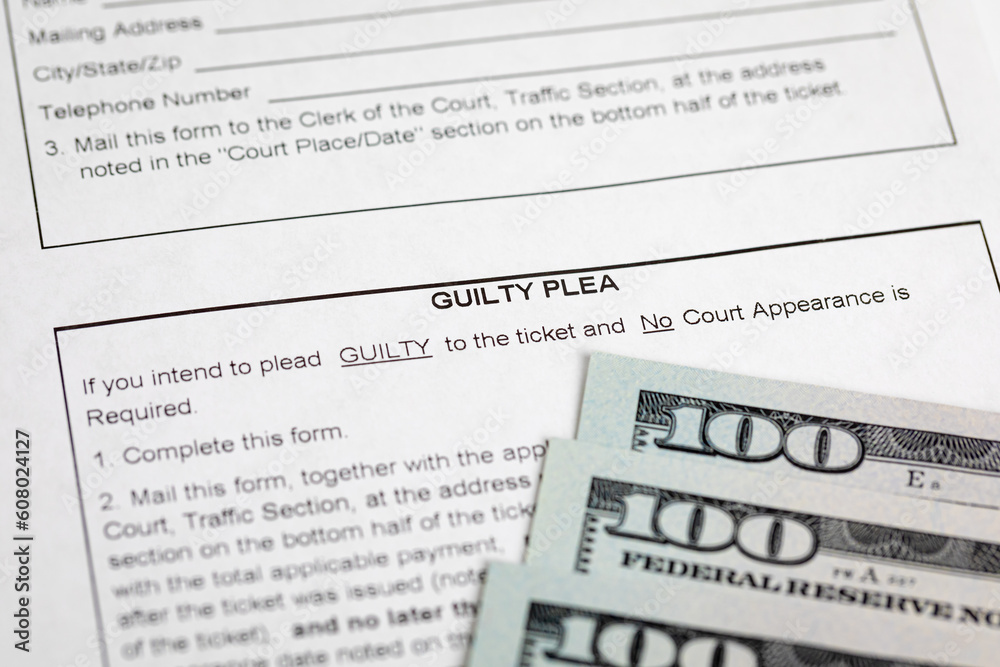 Traffic ticket form and cash money. Traffic citation, fine and law concept. Traffic ticket form and cash money. Traffic citation, fine and law concept.