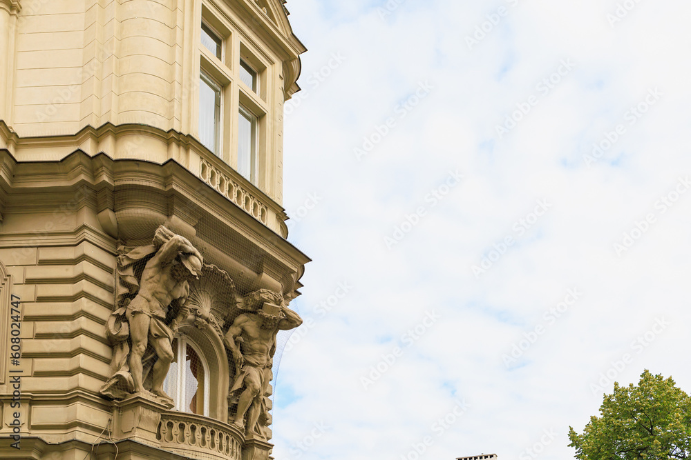 Ancient sculptures in the architecture of the city. Historical and cultural heritage. Background.