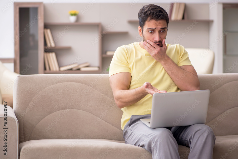 Young man working from home during pandemic Young man working from home during pandemic