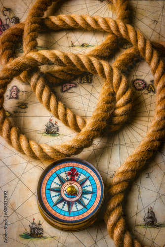 Compass And Rope On Old Map