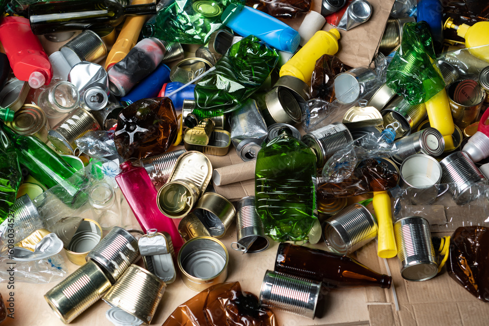 Plastic glass metal paper cardboard waste and recycling. Sorted