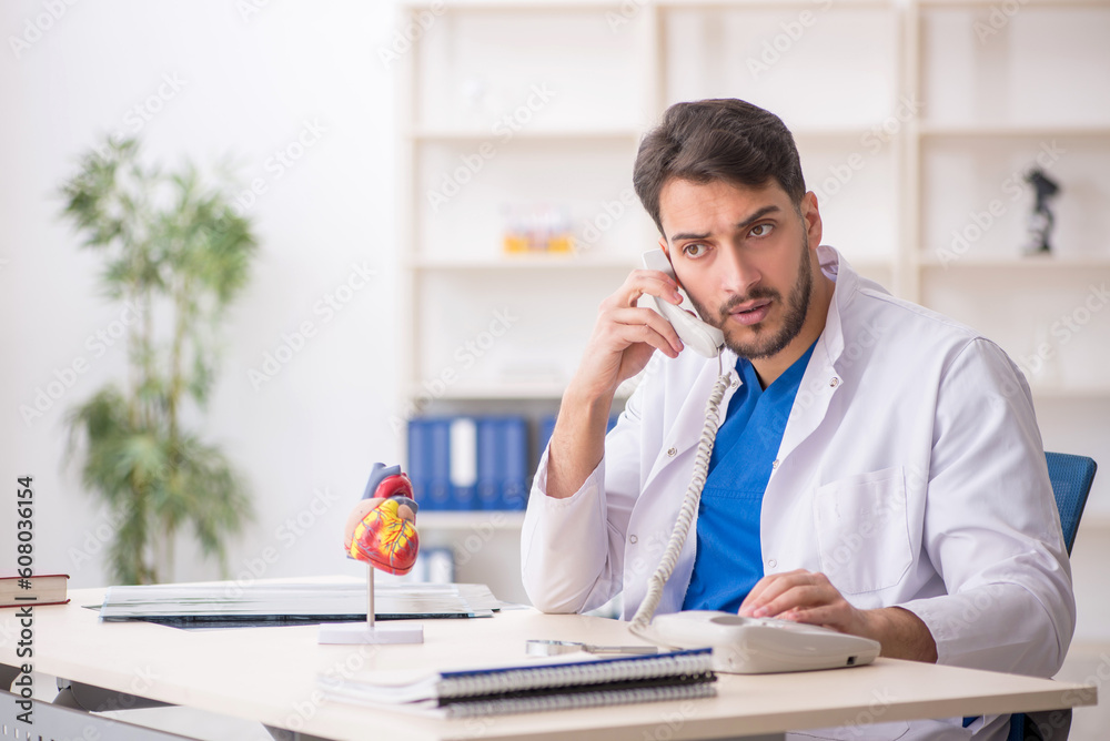 Young male doctor in telemedicine concept Young male doctor in telemedicine concept