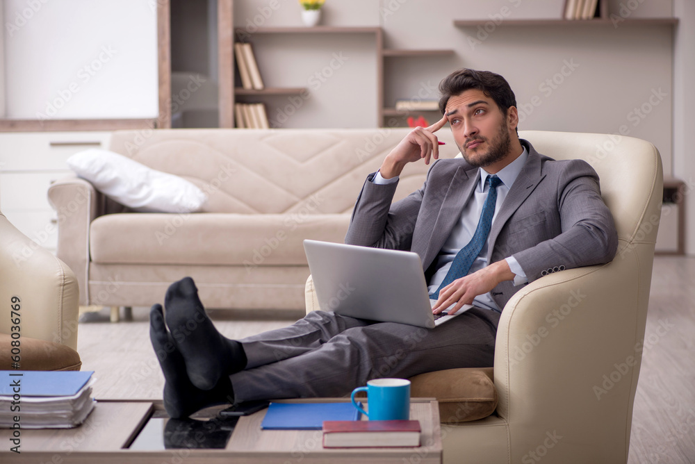 Young male employee working from home Young male employee working from home