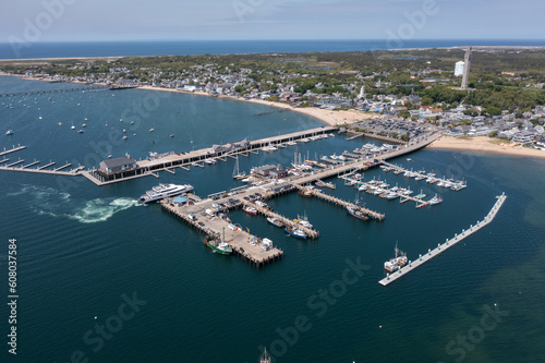 Fototapeta Naklejka Na Ścianę i Meble -  aerial landscape view of MacMillan Pier and Provincetown Marina in front and Provincetown city in the background 