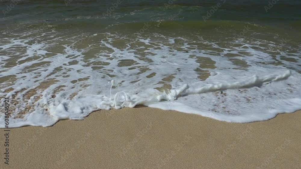 Soothing waves crashing on shore of sandy beach. Show motion video Soothing waves crashing on shore of sandy beach. Show motion video
