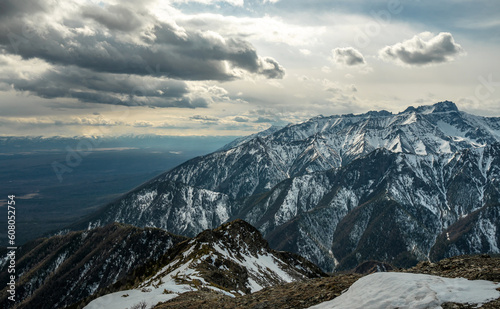 Landscape of snow-capped peaks of the rocky mountains in Sunny weather. Concept of nature and travel