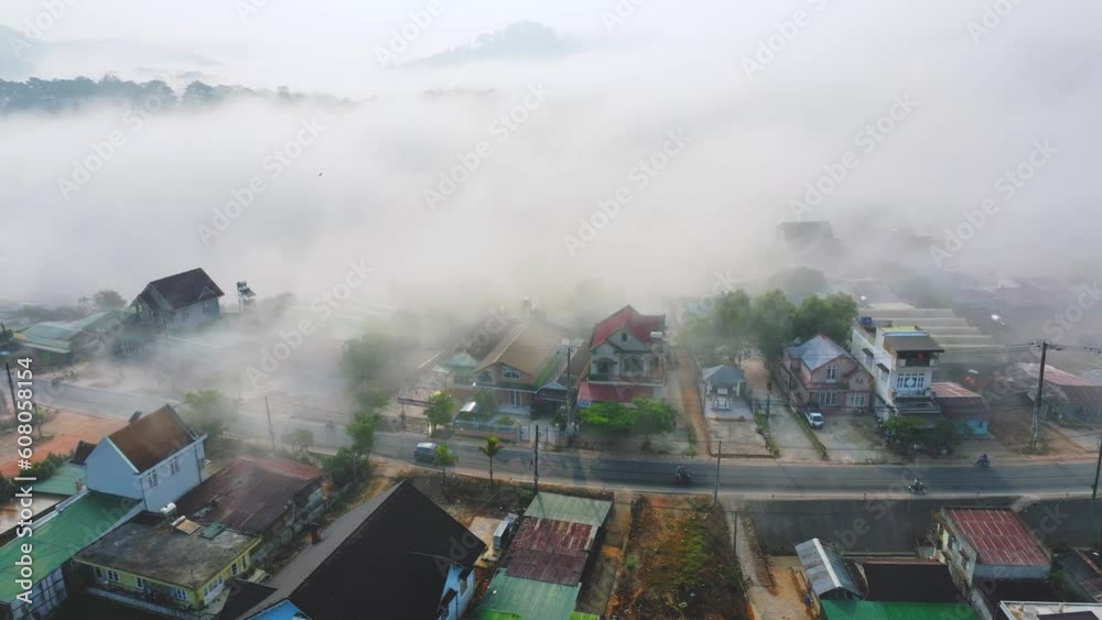 Aerial view of the Xuan Tho suburbs near Da Lat city at morning with misty sky in Vietnam highlands. Urban development texture, transport infrastructure, greenhouse in agriculture Aerial view of the Xuan Tho suburbs near Da Lat city at morning with misty sky in Vietnam highlands. Urban development texture, transport infrastructure, greenhouse in agriculture