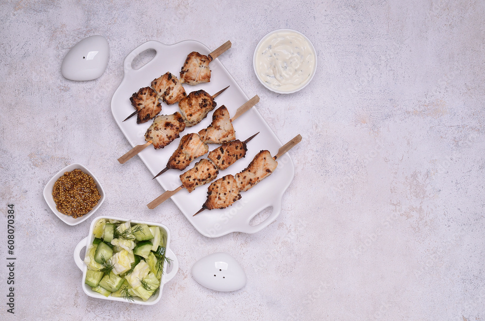 Fried slices of meat on wooden skewers. Fried slices of meat on wooden skewers.