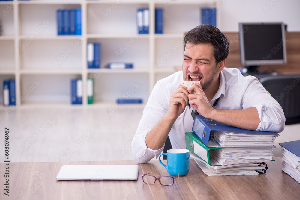Young male employee feeling bad at workplace Young male employee feeling bad at workplace