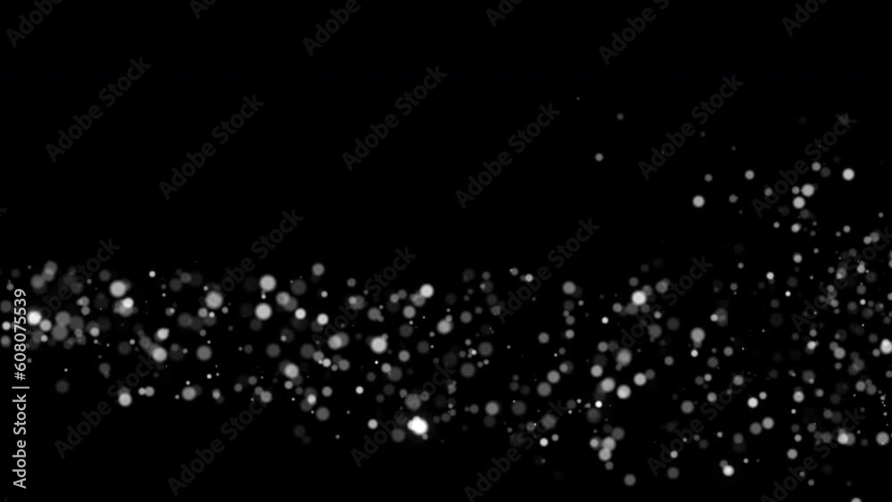 Flickering particles with bokeh effect. glitter lights on a black background. Decorative luxury element.