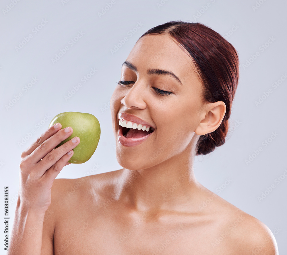 Apple, happy or woman in studio eating on white background for healthy nutrition or clean diet. Bite, smile or hungry beautiful girl advertising or marketing natural organic green fruits for wellness Apple, happy or woman in studio eating on white background for healthy nutrition or clean diet. Bite, smile or hungry beautiful girl advertising or marketing natural organic green fruits for wellness