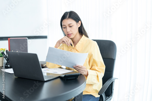 business woman using laptop or notebook computer with data analysis graph dashboard  confident woman working with computer laptop concept  contact idea design dashboard graph business conceptual.