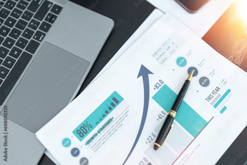 business desk with keyboard report chart pen and tablet on black table business desk with keyboard report chart pen and tablet on black table