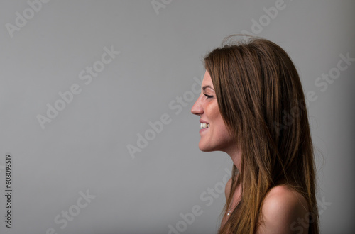 Young woman smiling in profile