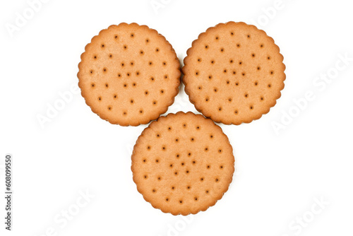 Three round biscuits on a white background. View from above. Sweet crunchy cookies with filling.