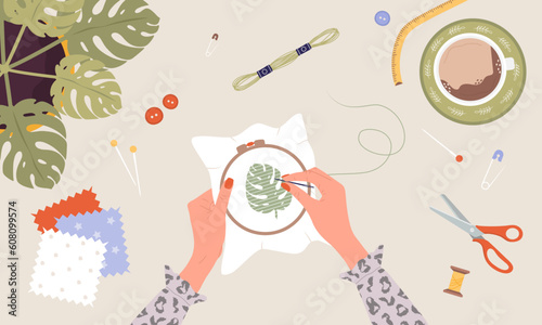 Embroidery process. Workshop, needlework and knitting. Female hands with needle and thread. Top view of the workplace. Tailor shop elements. Hand drawn vector illustration in flat cartoon style.