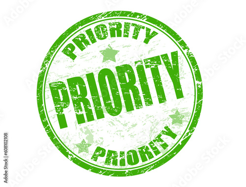 Green grunge rubber stamp with the word priority written inside the stamp
