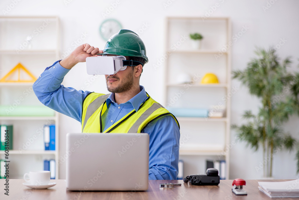 Young male architect wearing virtual glasses Young male architect wearing virtual glasses