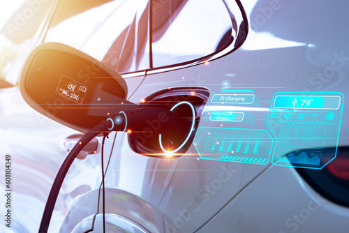 EV Charger, Power cable plug charging power to electric vehicle EV car with modern technology UI control information display, car chager station connected power cable alternative sustainable eco energ